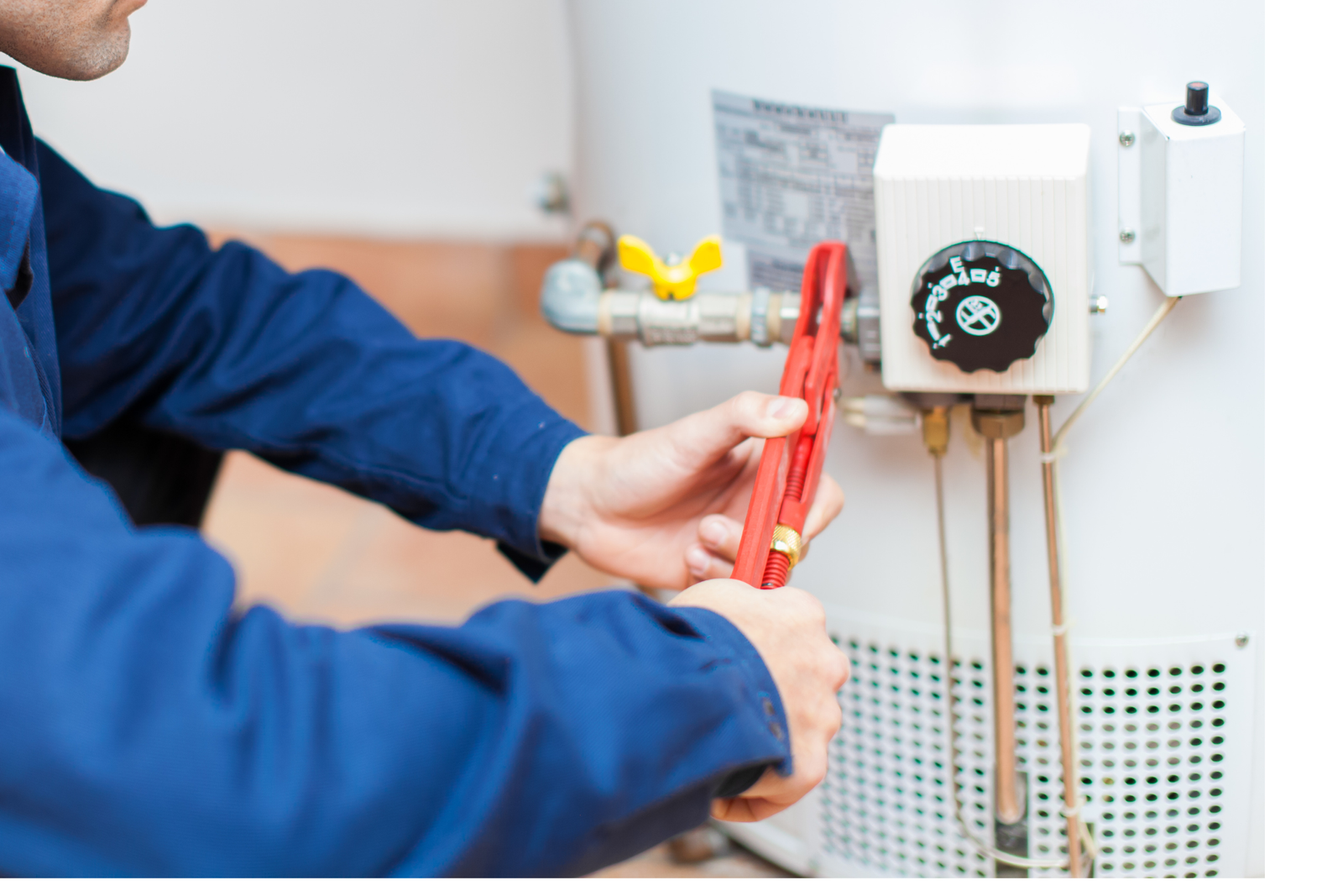 Plumber fixing the water heater